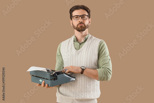 Young male writer with vint...