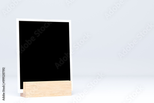 Three blank instant photo frames on wooden hemisphere stands, minimalist mockup template on transparent background