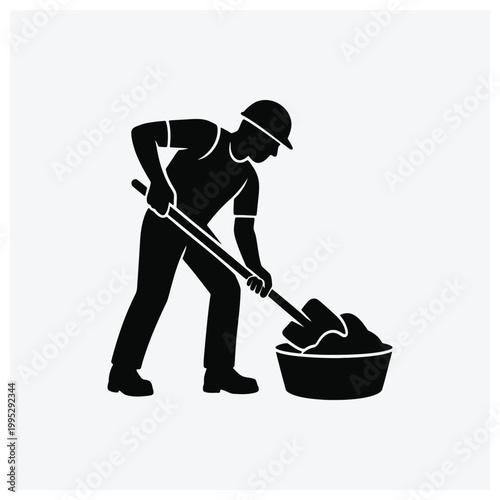 Worker scooping materials or ingredients with a shovel