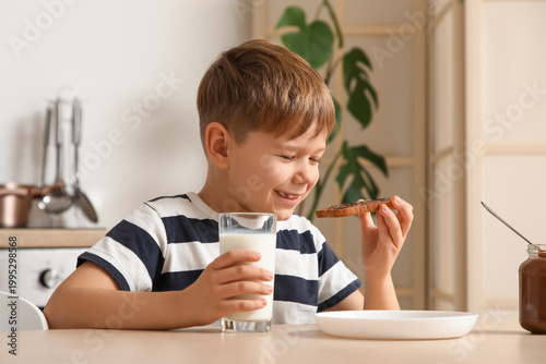 Cute little boy eating toas...