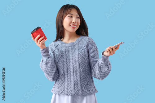 Young Asian woman with cup ...