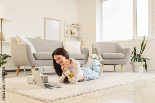 Young woman video chatting ...