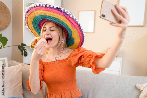 Young woman in sombrero hat...