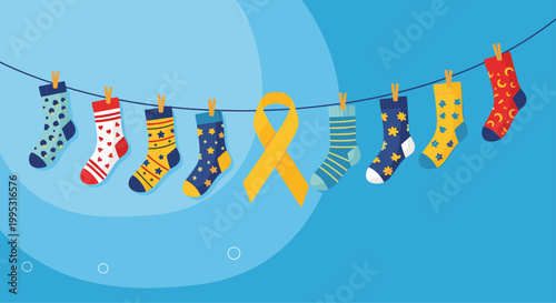 Row of colorful patterned socks hanging on a clothesline with a yellow awareness ribbon for Down Syndrome awareness day.