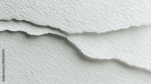 Torn Paper Texture: Close-up shot of torn paper showing a textured surface, showcasing the detail and tactility of the material.