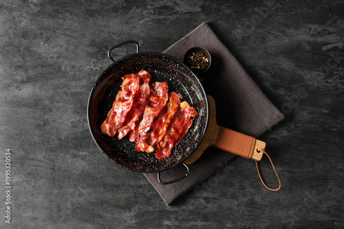 Frying pan with fried bacon...