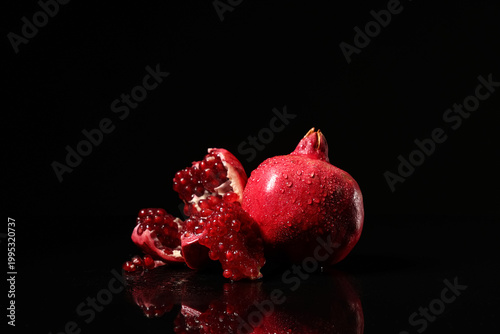 Fresh whole and cut pomegra...