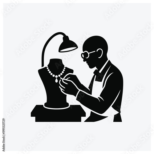 Man fitting a necklace on a mannequin bust