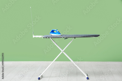 Board with electric iron ne...