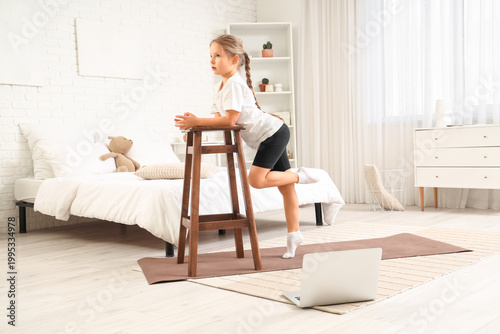 Cute little girl with mat a...