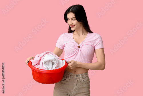 Young woman holding basket ...