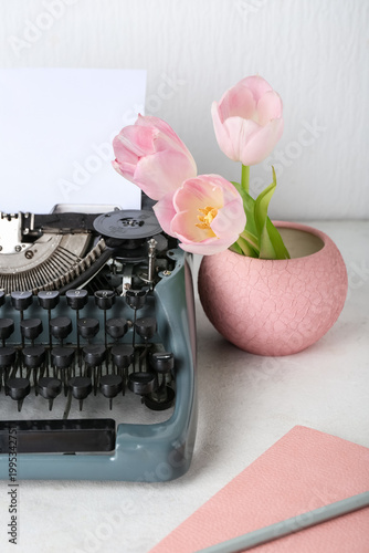 Vintage typewriter with pap...