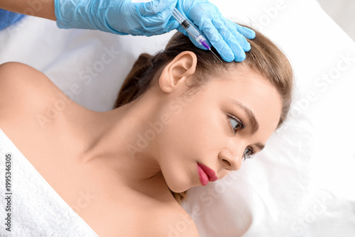 Young woman receiving fille...