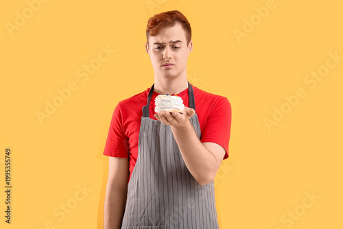 Male confectioner in apron ...