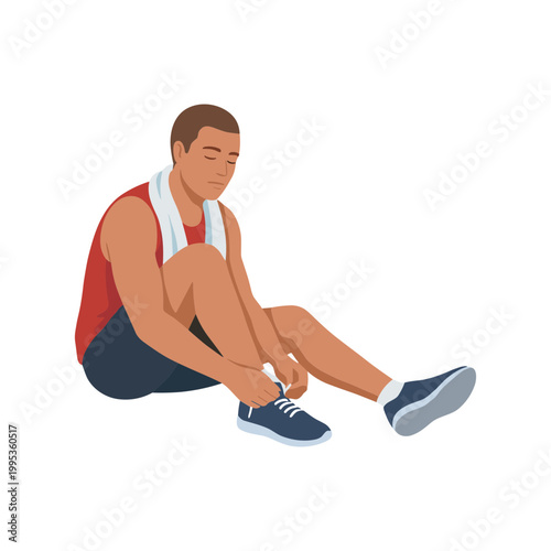 Man sitting on ground tying shoe laces after exercise with towel