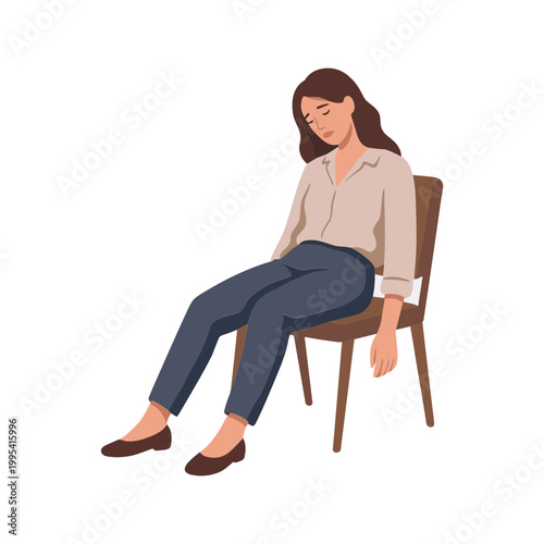 A woman sits on a chair looking down with her legs crossed.