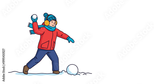 Cheerful young boy wearing warm winter clothing and earmuffs preparing to throw a snowball in a snowy outdoor winter landscape.