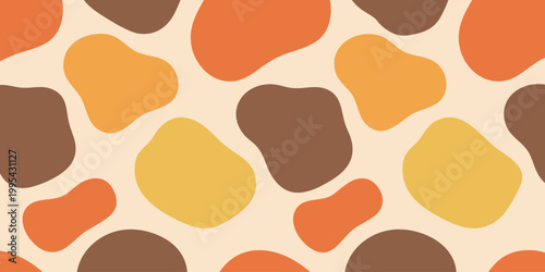 Vibrant animal print pattern with abstract shapes in orange, yellow, and brown hues on a beige background