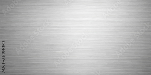 A sleek brushed metal plate texture featuring a shiny stainless steel surface with a silver metallic pattern on an industrial aluminum sheet backdrop
