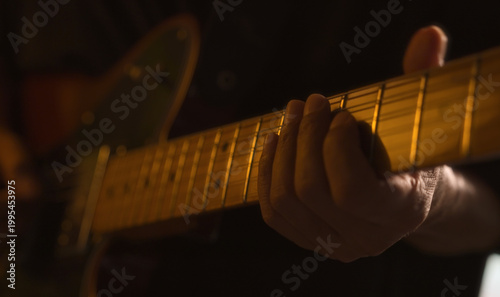Man playing acoustic guitar. close up