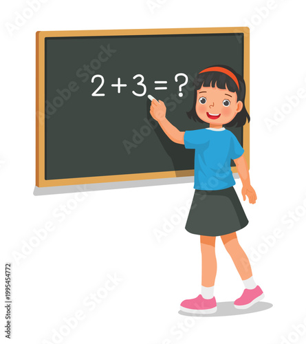 Girl student writing on blackboard math equation in front of class with chalk

