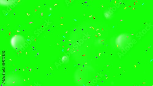 A vibrant green screen with colorful confetti falling from the top in a celebratory video