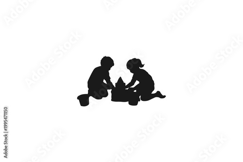 Silhouettes of boy and girl playing in a sandbox