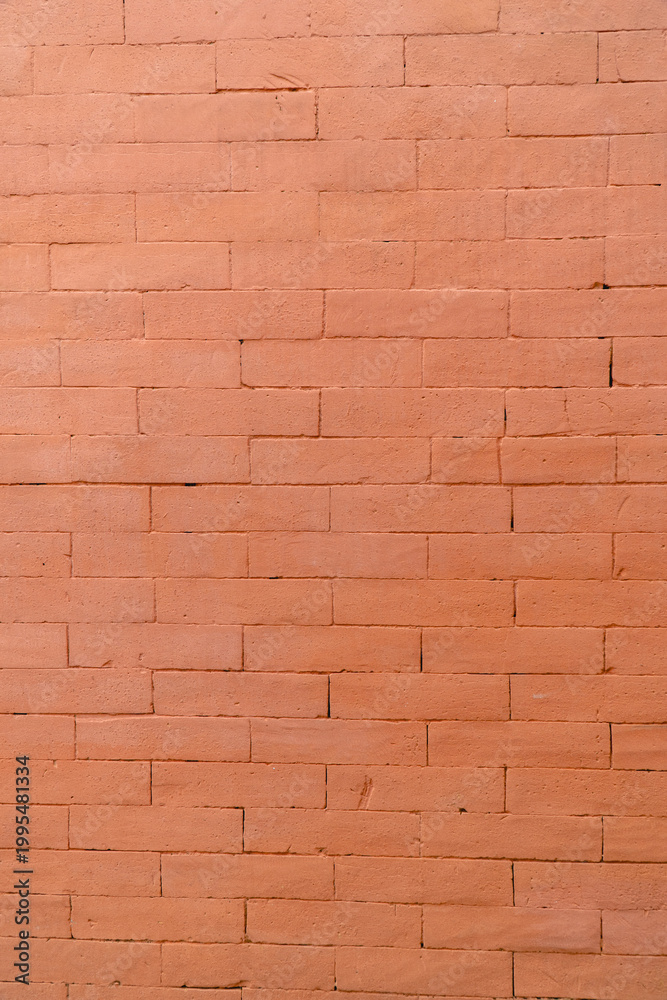Fototapeta premium Orange brick wall texture with clean horizontal pattern, construction background for architecture, design, and copy space