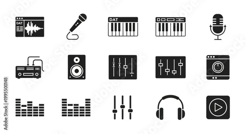 Music production studio equipment layout with keyboard and headphones on