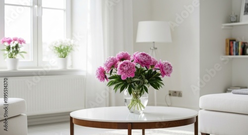 Bright interior with peonies on a table