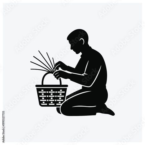 Silhouette of person harvesting or picking produce in a basket