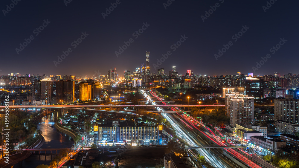 Obraz premium Beijing city night skyline with traffic light trails along the Tonghui River, China