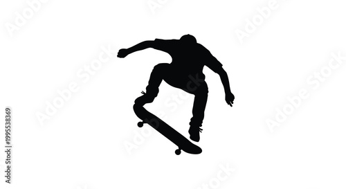 Silhouette of a skateboarder performing a trick in mid air