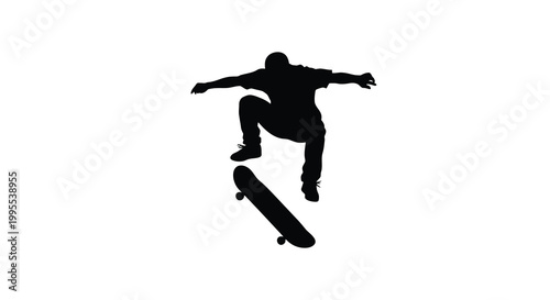 Silhouette of a skateboarder performing a trick in mid air