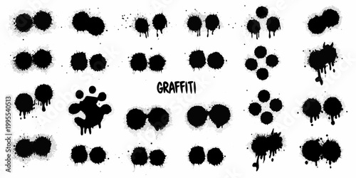 Collection of abstract black spray paint splatters and drips on white