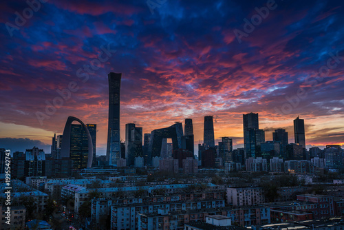 Fiery sunset clouds over Beijing business district skyline at nightfall
