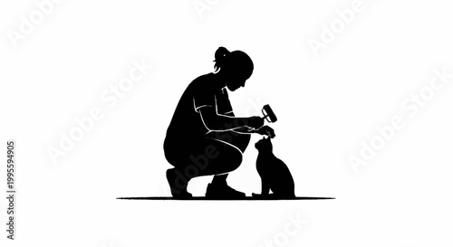 A woman gently grooming a cat with a brush in a quiet moment