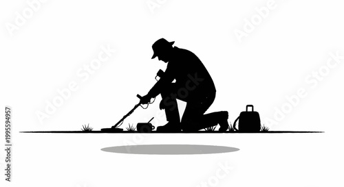 A man kneels on the ground using a metal detector to search for treasure