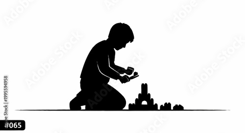 A silhouette of a child building a castle with blocks