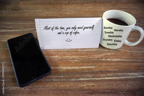 Inspirational motivational quote - Most of the time, you only need yourself and a cup of coffee. With black phone and morning coffee, mug with names of days. Self love care. Love yourself everyday.