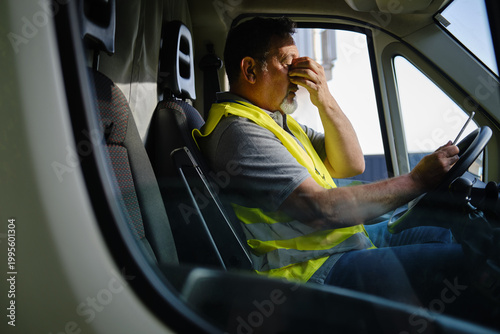Quadro su tela Mature man covering eyes experiencing stress in truck