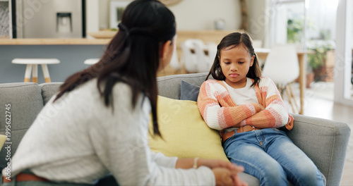 Photos Listening, discipline and mom with girl on sofa for behavior, trouble and bad attitude in home