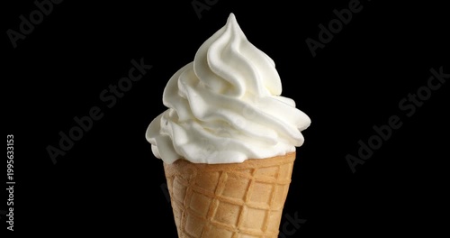 Vanilla ice cream in a waffle cone close-up on a turntable. Close-up footage on a black background.