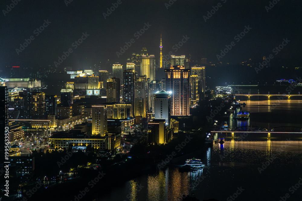 Fototapeta premium Panoramic view of Pyongyang from Yanggakdo Hotel. Taedong River in morning fog. Ryugyong Hotel and modern residential complex upstream. Atmospheric, calm, iconic. Pyongyang, North Korea