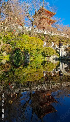 The three-story pagoda at Kiyomizu-dera with its reflection in a pond, Kyoto, Japan