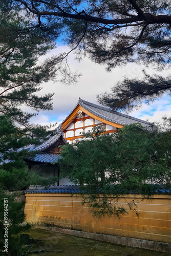 Traditional Buddhist temple architecture with tiled roof in Kyoto, Japan