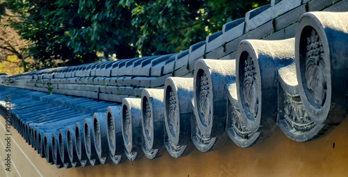 Traditional Buddhist temple architecture with tiled roof in Kyoto, Japan