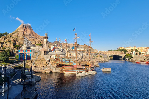 Historic ship and Mediterranean Harbor view framed by stone archway at Tokyo DisneySea, Japan