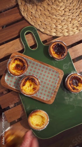 Pastel de nata on a ceramic tray top down shot