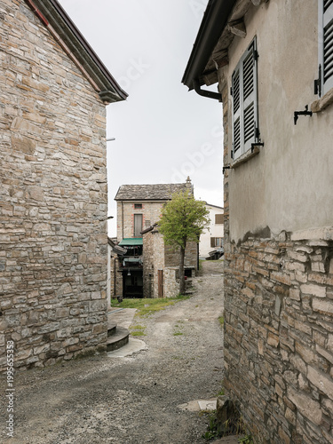 Rural stone houses and narrow path in Bettola village, Piacenza countryside